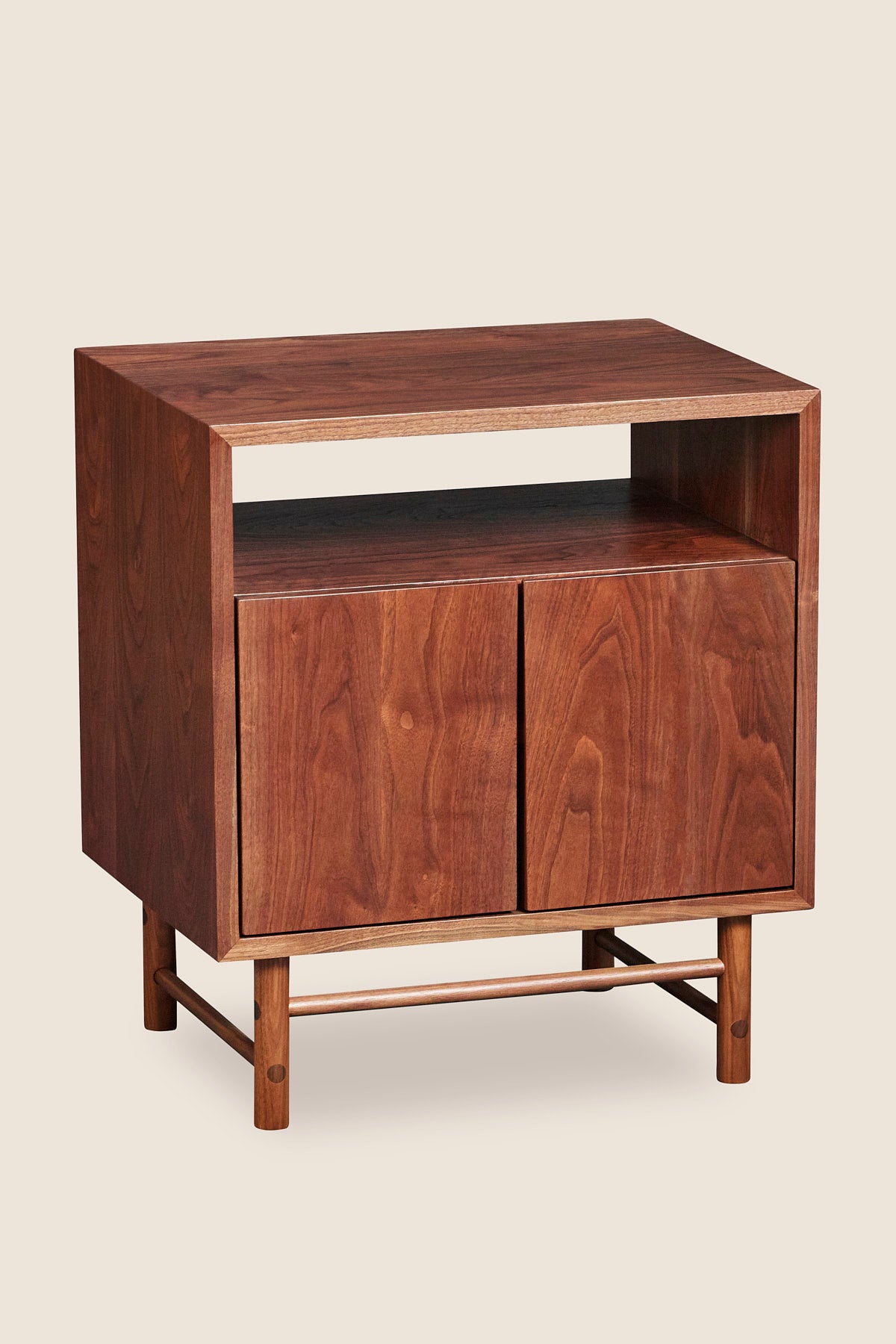 Mid-century modern Navarend media case in solid walnut wood with round legs and stretchers and two doors with storage space